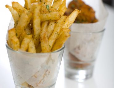 French fries served in glasses dispells the dilemma of fingers versus fork. Photo by Heidi Geldh