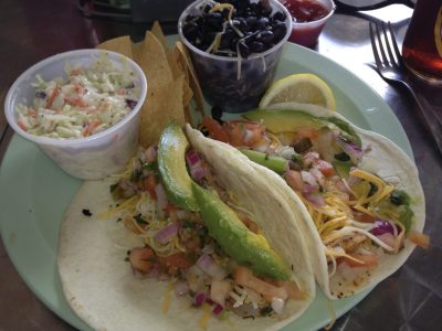 Hook'd serves up an awesome plate of delicious fish tacos. The view of the ocean is included for free.