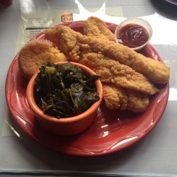 The fried catfish plate at Mama J's Kitchen, served with a side of greens and the best corn muffin that I regret sharing with my husband. 